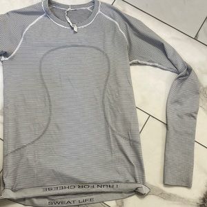 Lululemon Swifty tech long sleeve - tiny stain on bottom of shirt